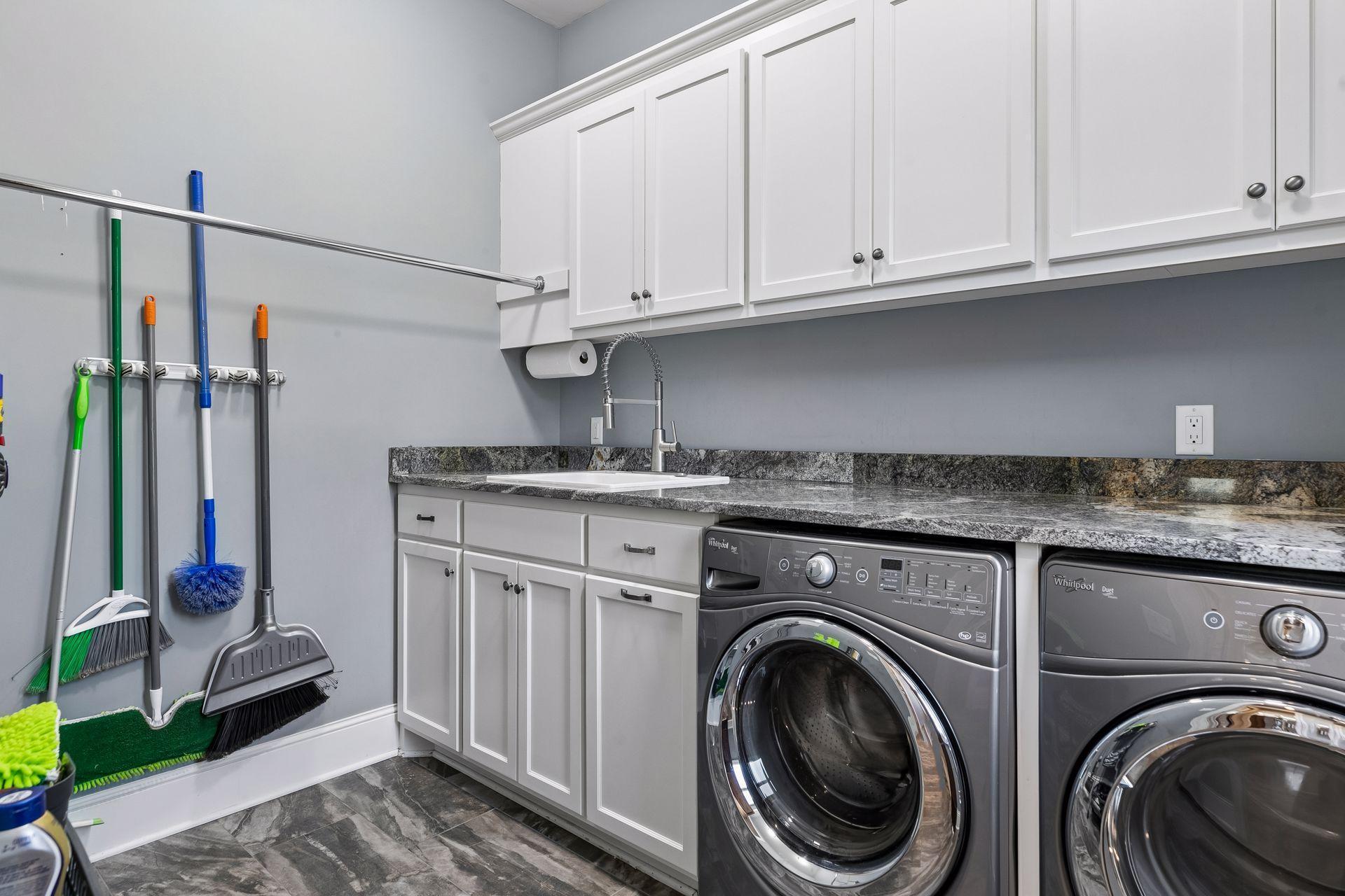 Spacious laundry room with a sink and lots of countertop space