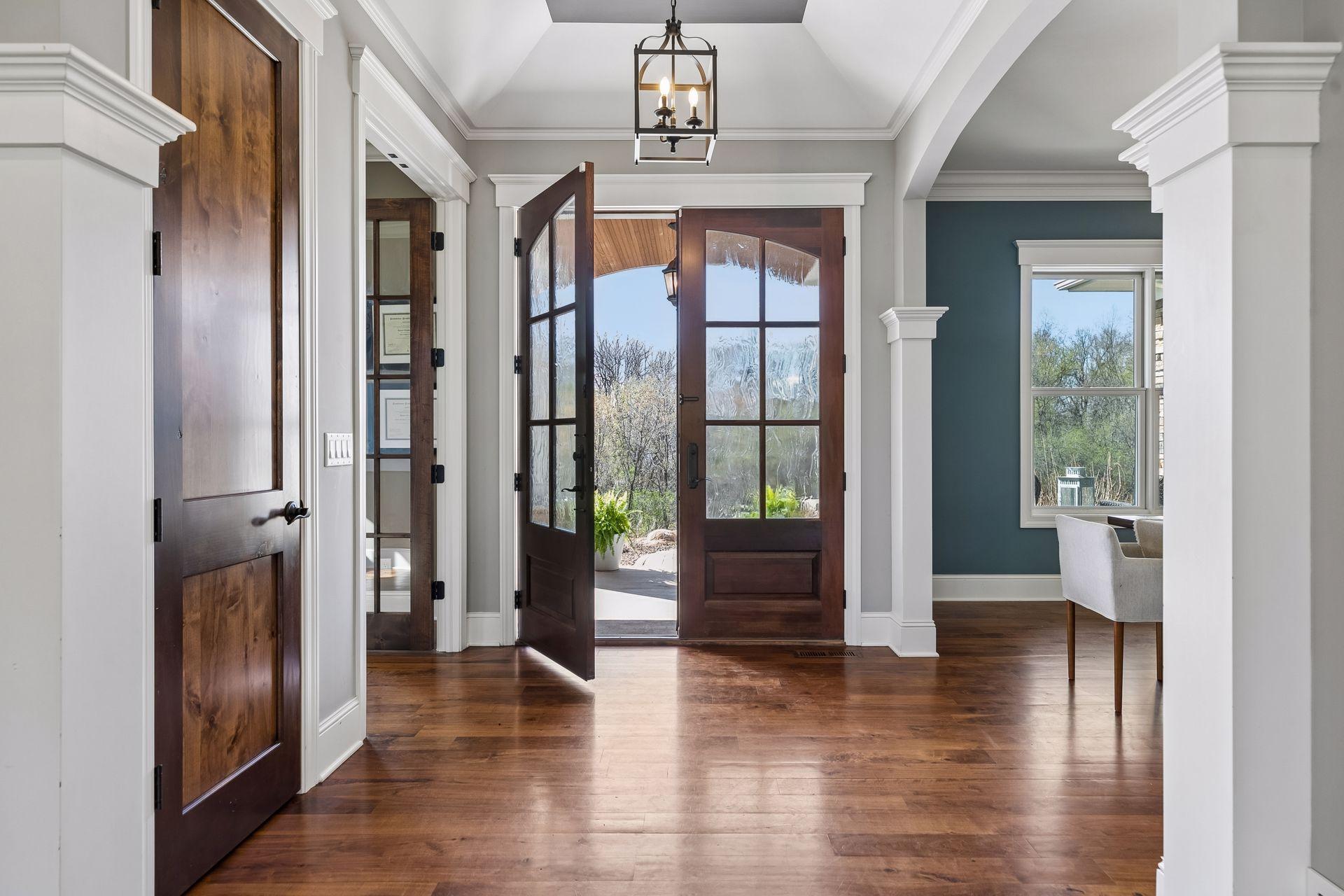 Tall double door entrance with 10 ft ceilings