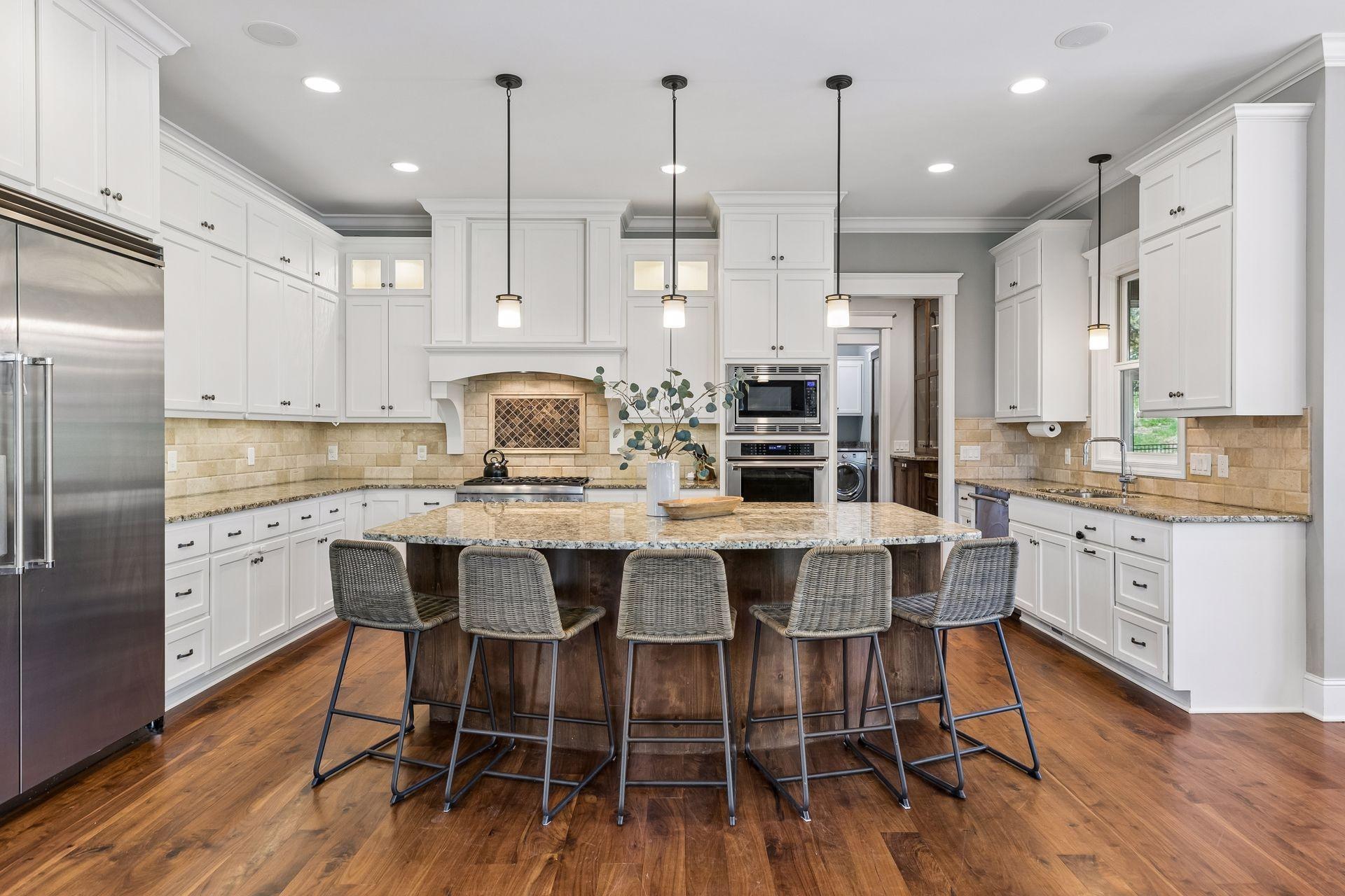 Large kitchen with granite countertops