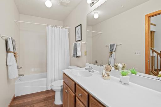 Beautiful main floor walk-thru bathroom complete with separate tub and shower.