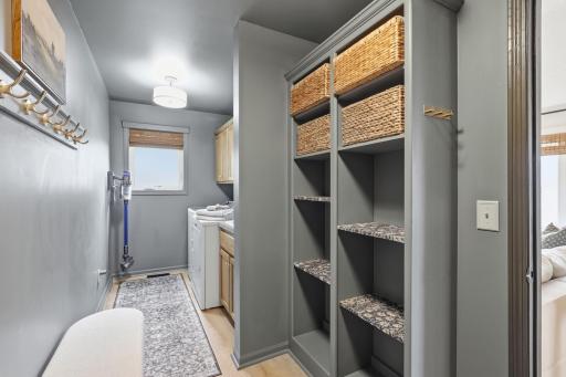 Main floor mudroom/laundry room with cubby storage and bench seating.
