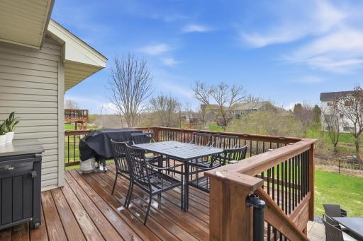 Fabulous deck with maintenance free spindles. Stairs leading to patio. Solar lights on railing.
