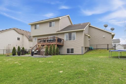 Huge, level backyard with beautiful landscaping.