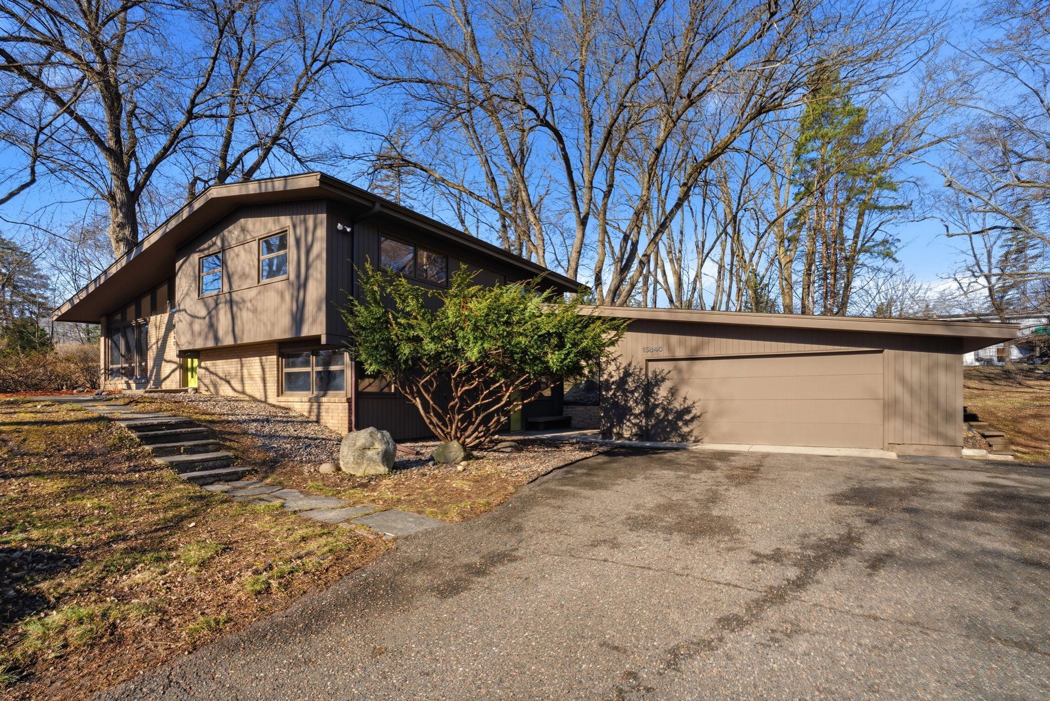 With an oversized two-car garage and true mid-century design, this home is packed with charm.