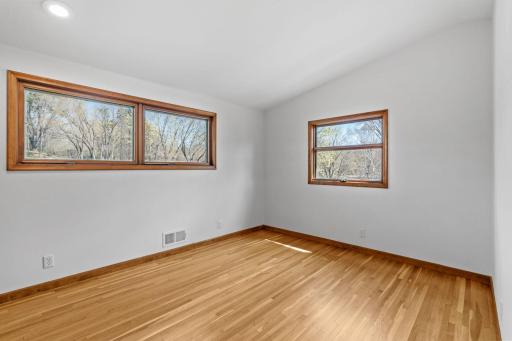 The second bedroom is filled with natural light.