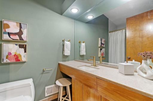 The shared upper level bathroom with new fixtures.