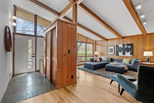 Welcome home to a stunning open floor plan, filled with natural wood and light.