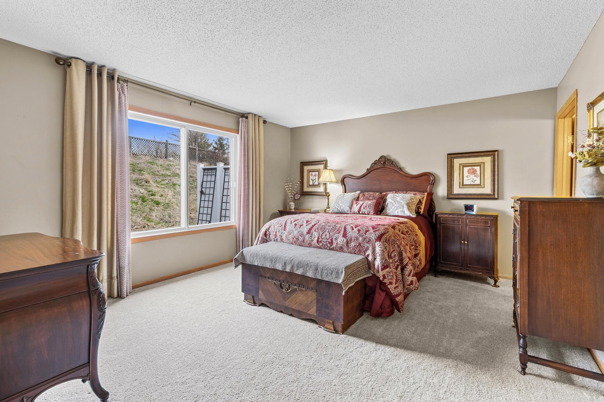 The spacious and bright Primary Bedroom is your own private retreat. It boasts great backyard nature views.