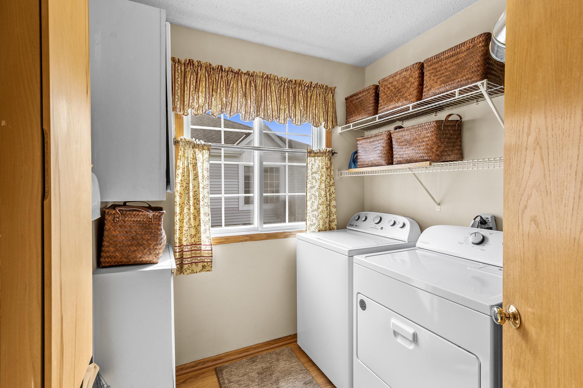 The main floor Laundry Room offers great storage space. Functional and stylish.