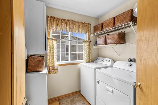 The main floor Laundry Room offers great storage space. Functional and stylish.