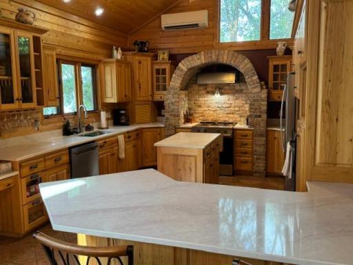 New quartz counter tops on penisula and center island.