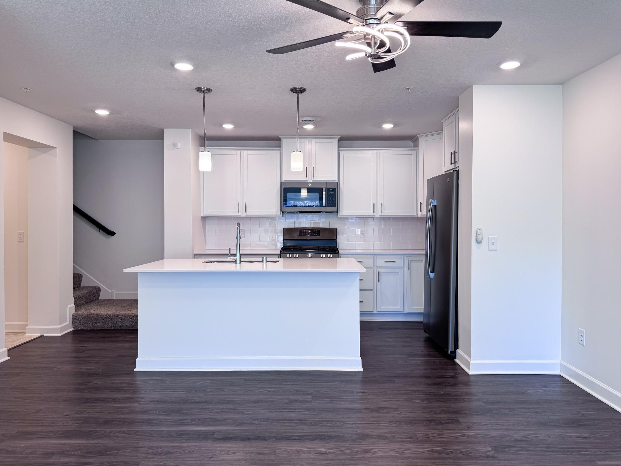Luxury vinyl plank flooring in kitchen and dining area