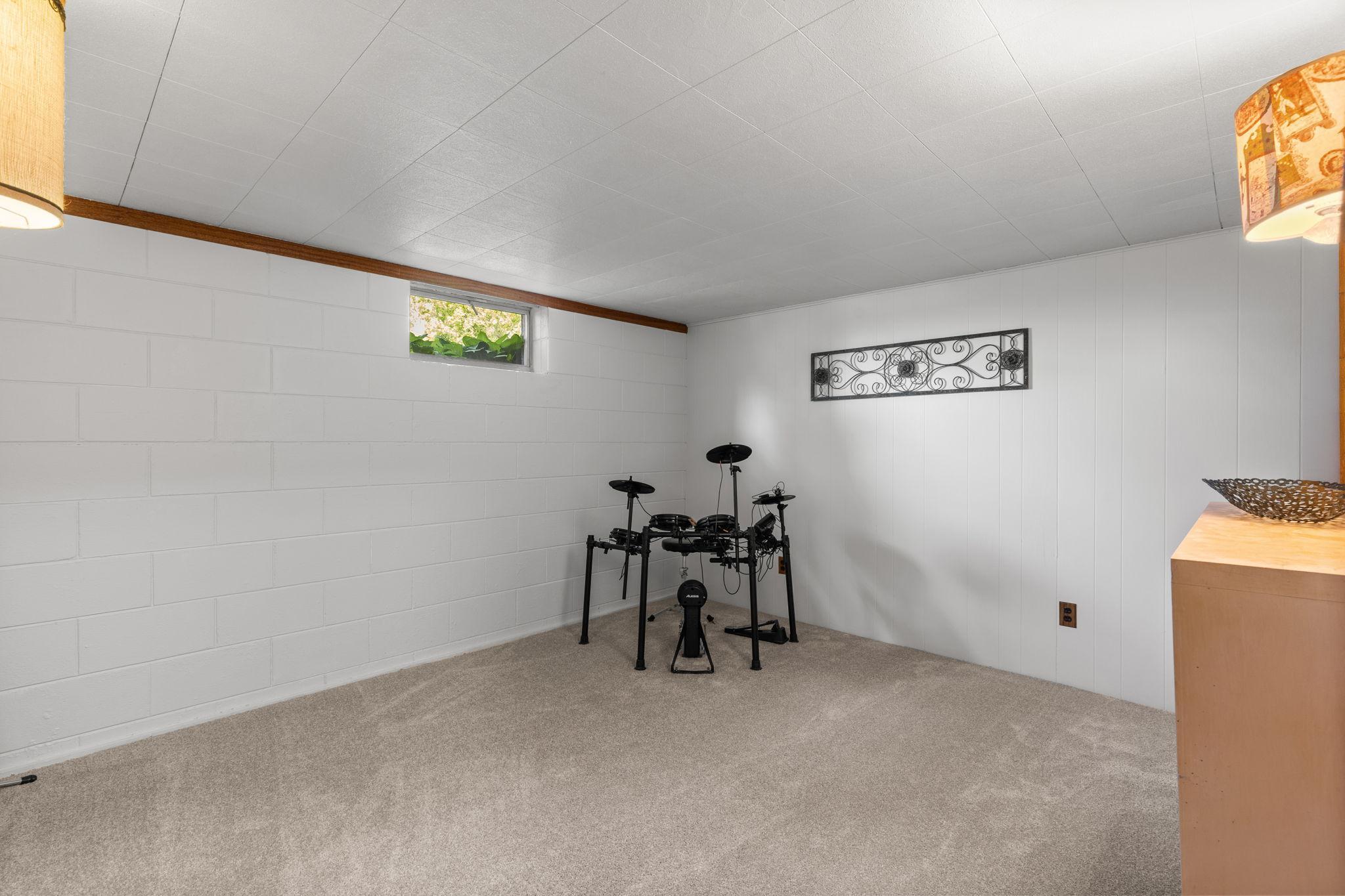 Lower level flex room currently used as music room, but would be a great office or play room.