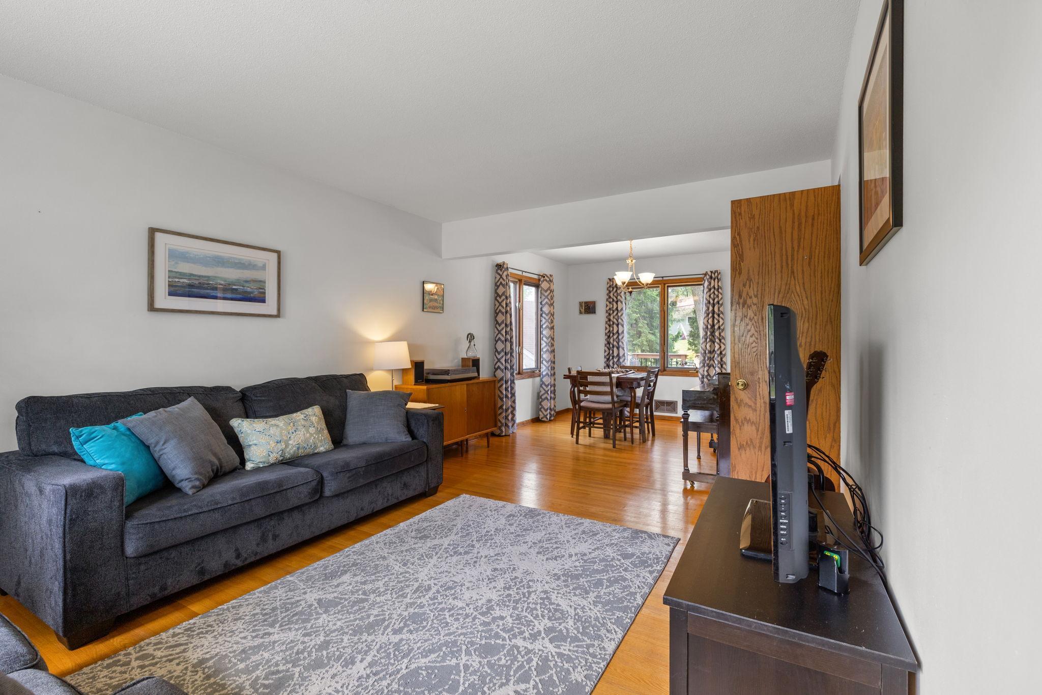 Gleaming hardwood floors carry thru the living dining area and both main bedrooms.