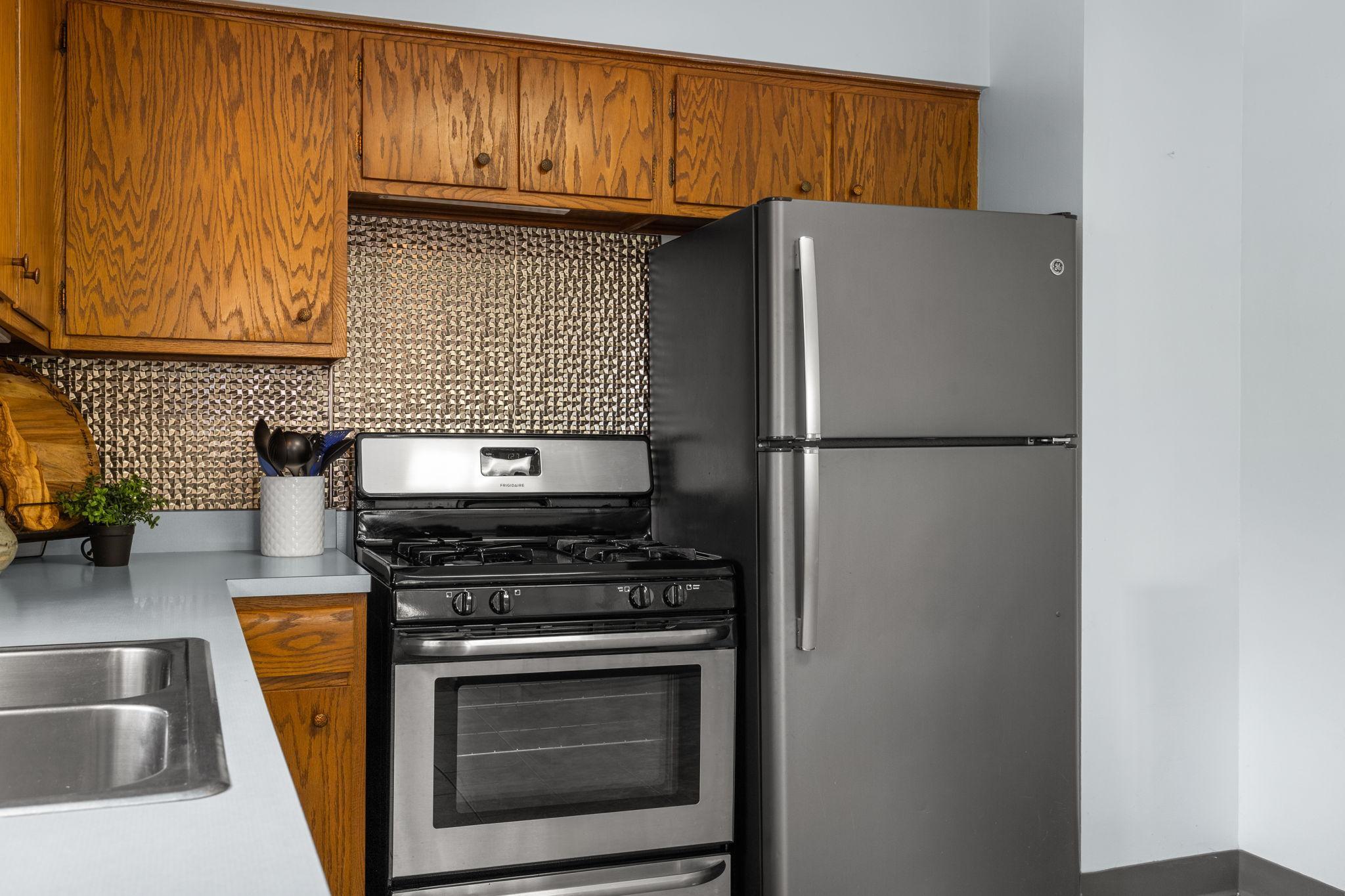 Backsplash and SS appliances update this lovely kitchen