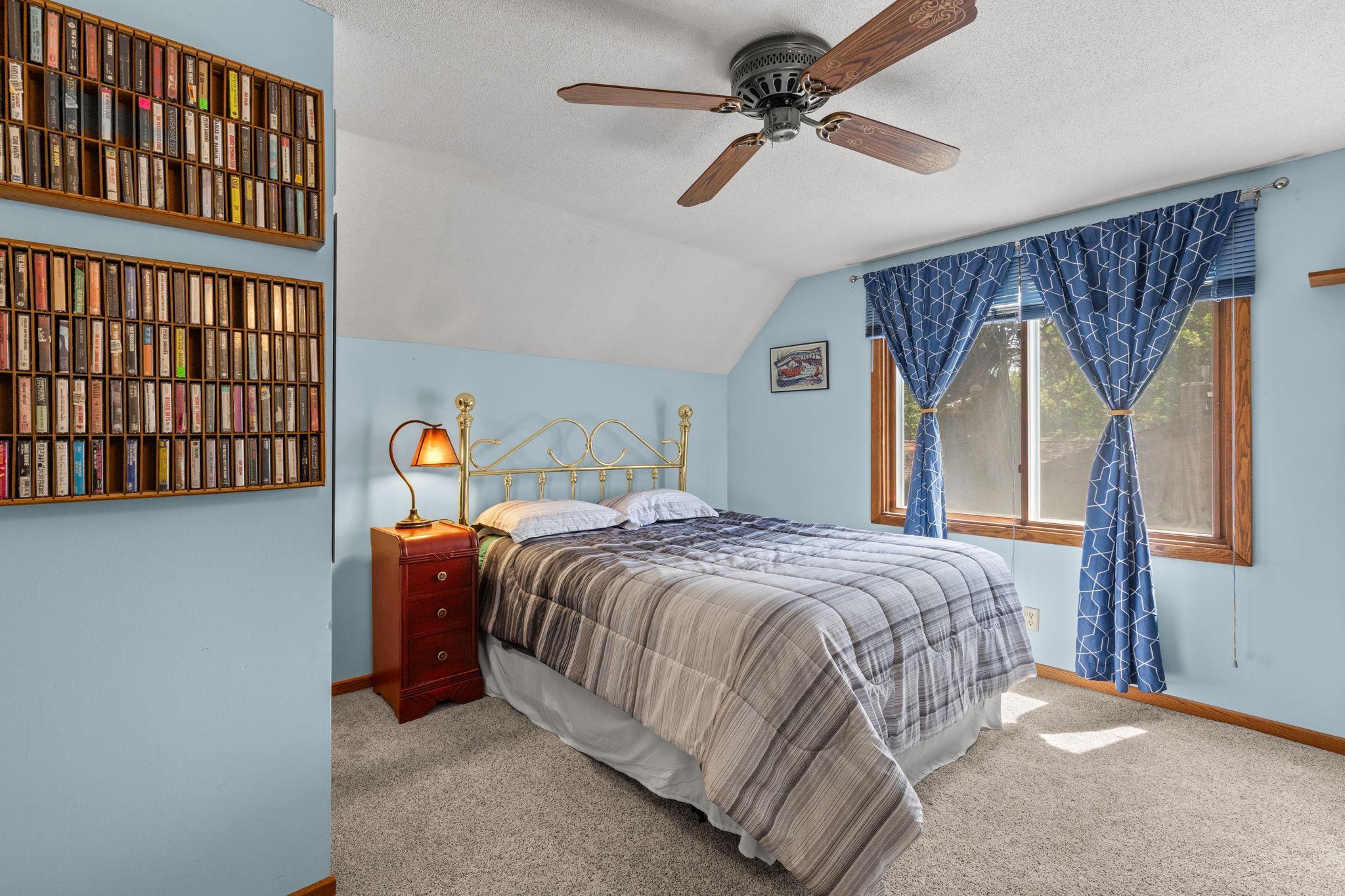 Upper level bedroom #3 has ceiling fan and lots of natural light.