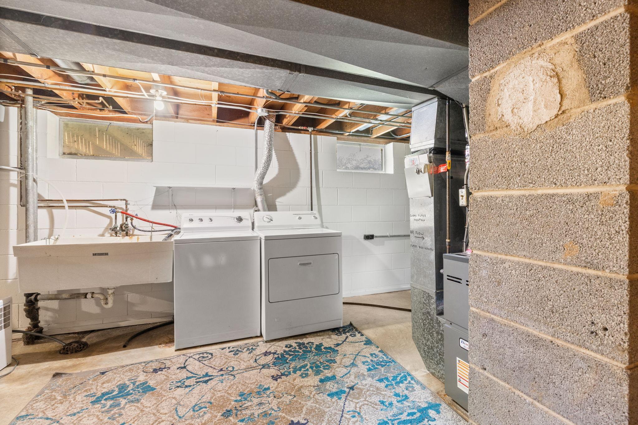 Bright laundry area and newer mechanicals.