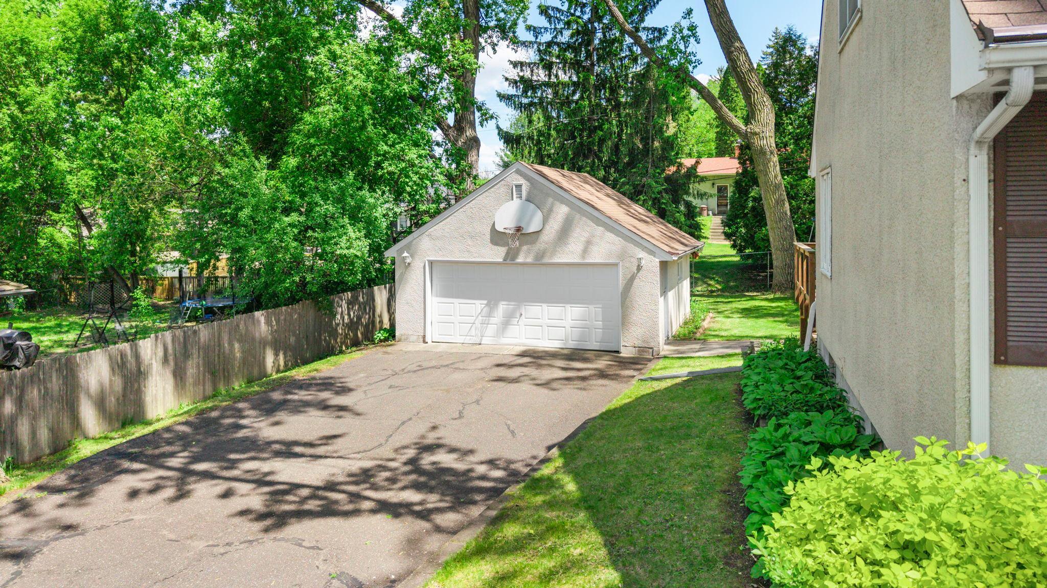 Side-yard gardens line your driveway