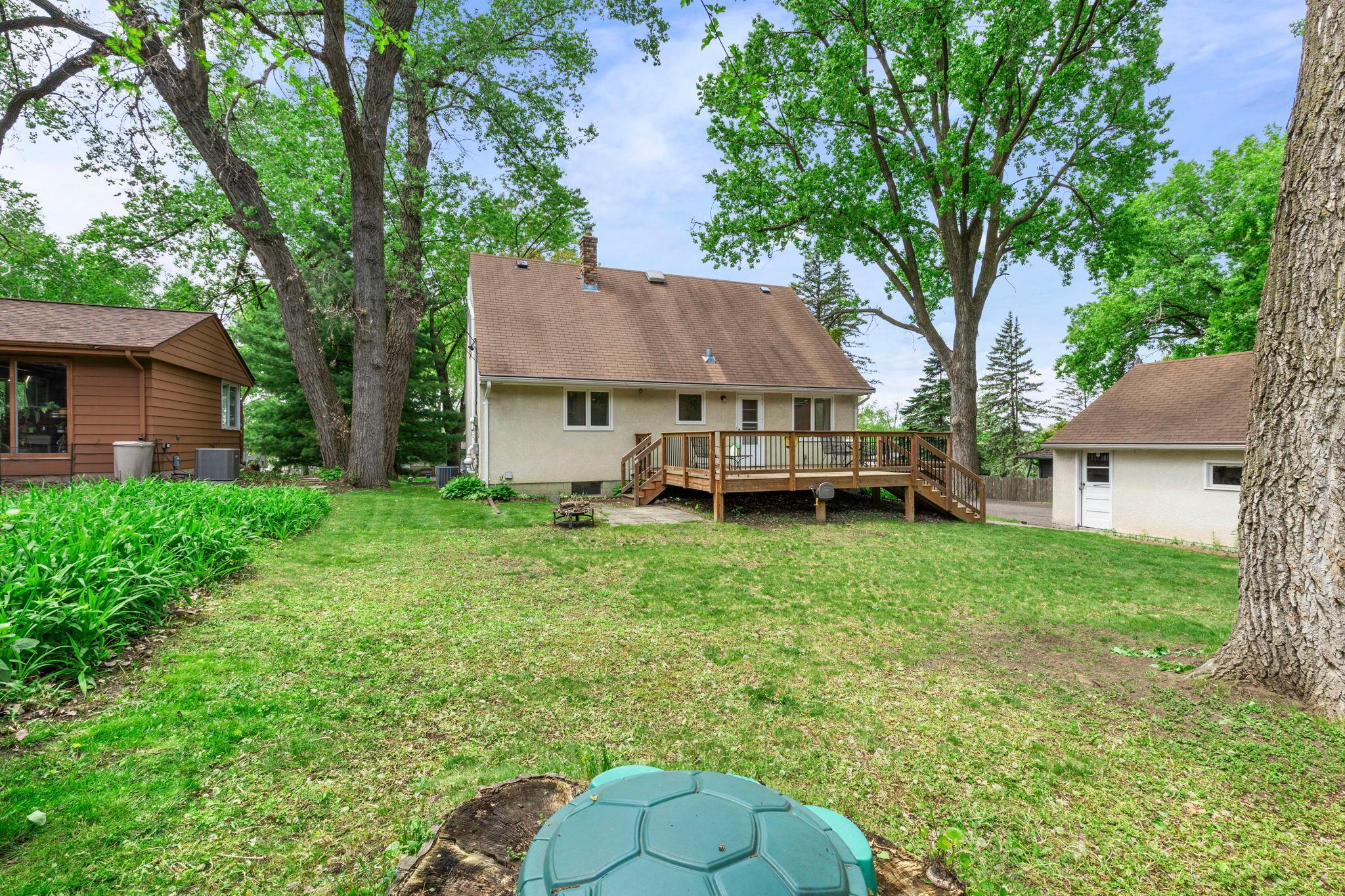 Back of house view from expansive backyard.