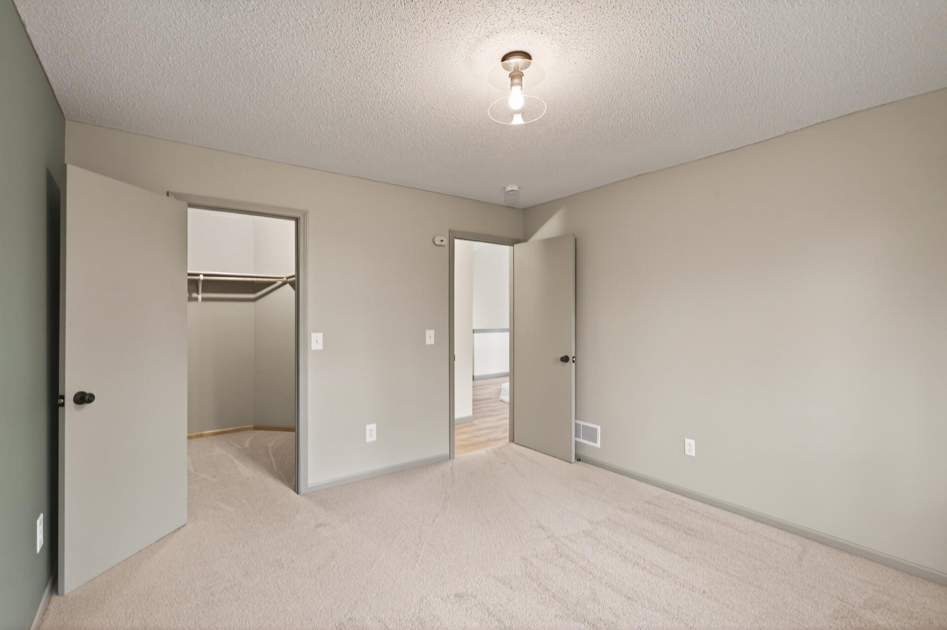 Walk in closet in large bedroom