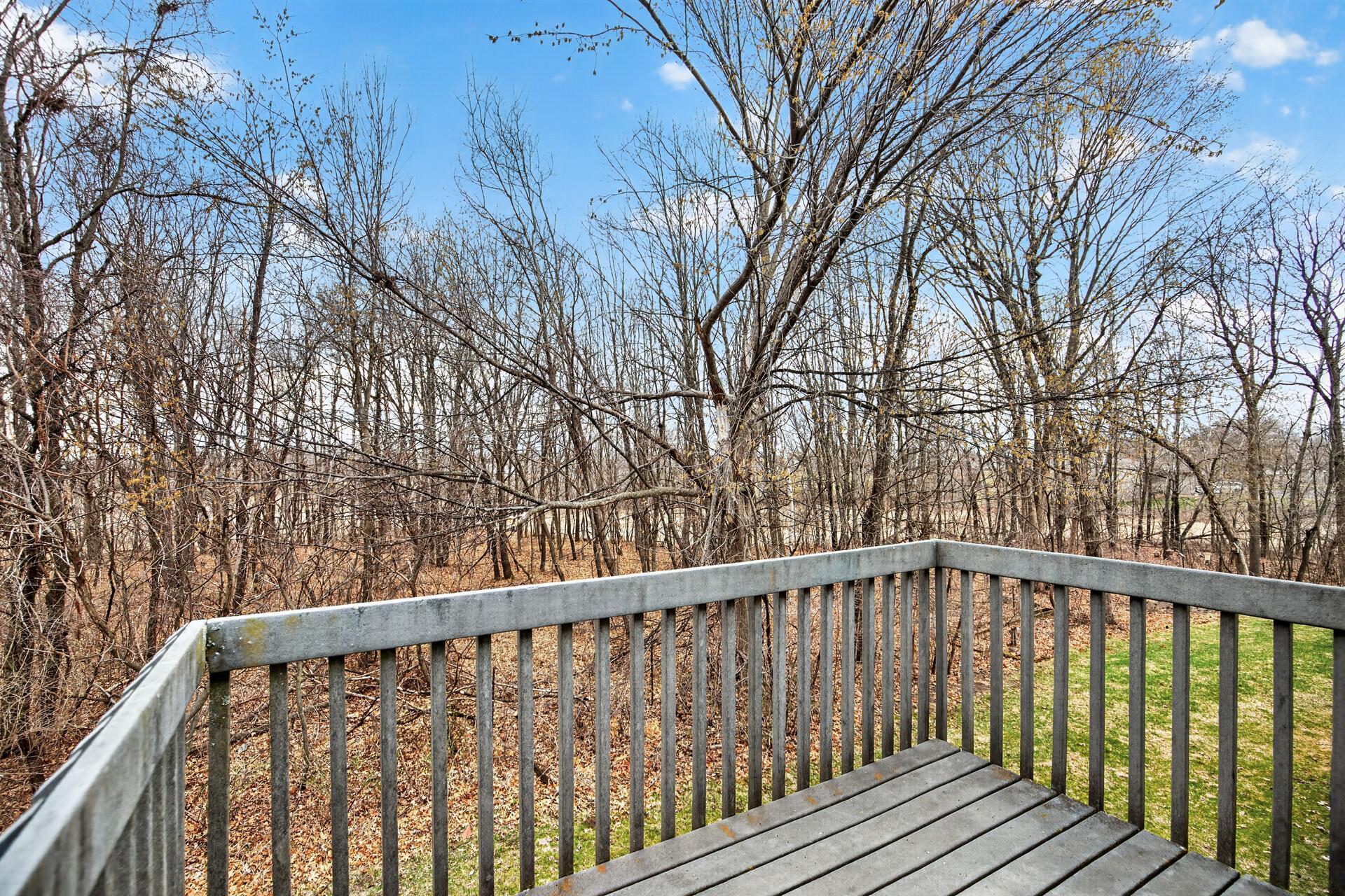 Deck with wood views and The Ponds just beyond