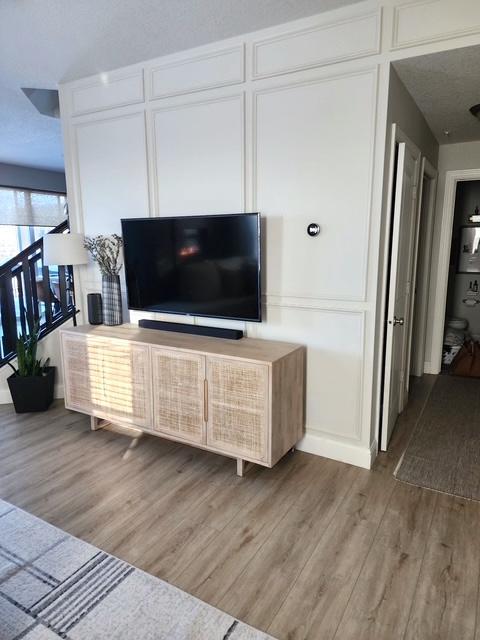 A thoughtful design detail that adds depth and character, the board and batten wall treatment brings a polished, custom feel to the living room.