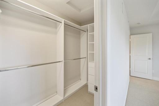 The custom closet keeps everything beautifully organized.