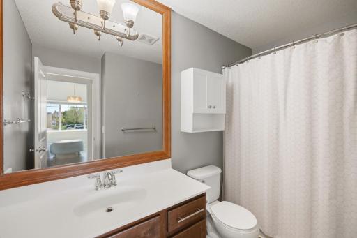 The upper level bathroom is thoughtfully appointed and designed for both the everyday routine and the occasional overnight guest.