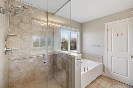 This thoughtfully designed bathroom has enough space for two to move through morning routines without sacrificing personal space.