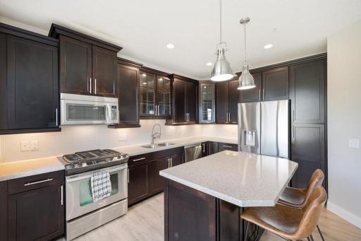 The breakfast bar, the granite countertops, a gas range â sometimes the details say it all.