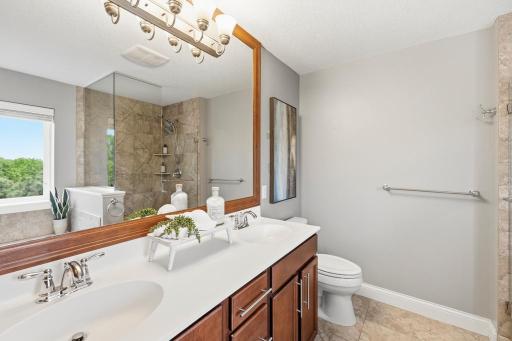 The ensuite bathroom is equally impressive. A dual bowl vanity ensures everyone has their own space to prepare for the day ahead.