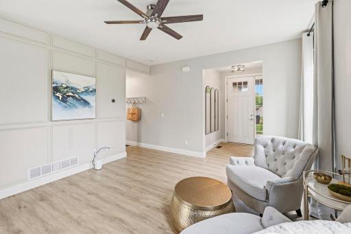 A thoughtful design detail that adds depth and character, the board and batten wall treatment brings a polished, custom feel to the living room.