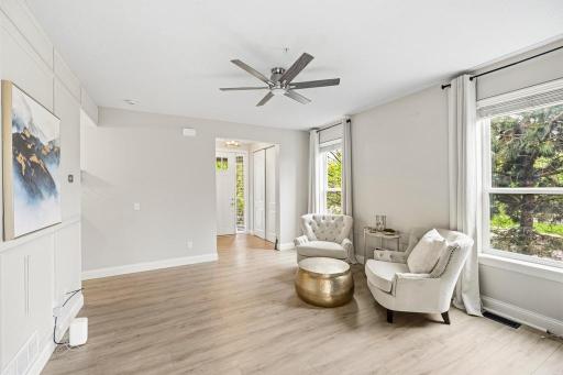 Bright, open, and anchored by a show-stopping black brick fireplace, this living room strikes the perfect balance between bold and inviting.