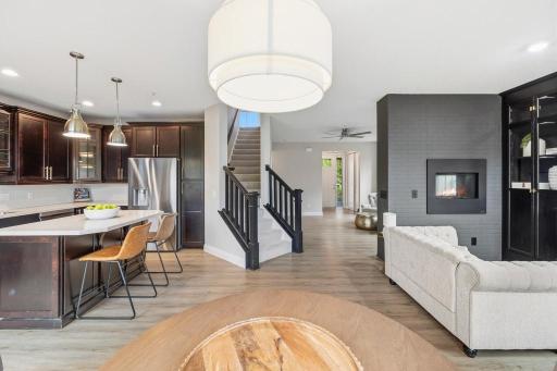 Natural light pours in from every angle, and with the kitchen just steps away, serving is effortless.