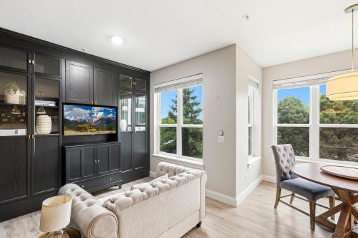 Moody, intimate, and full of character â the parlor room sets the tone with a dark palette, custom built-ins, and a double-sided gas fireplace.