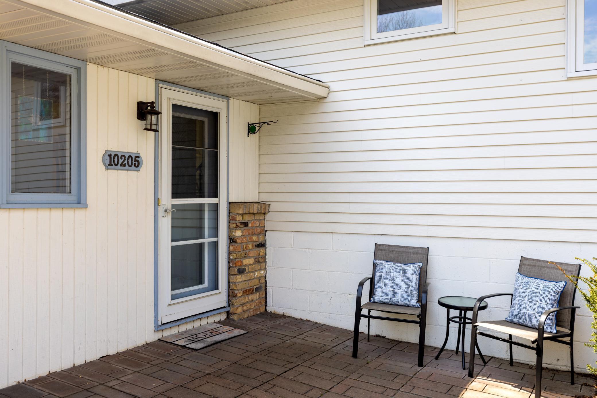 Front Paver patio for relaxing on a warm day.