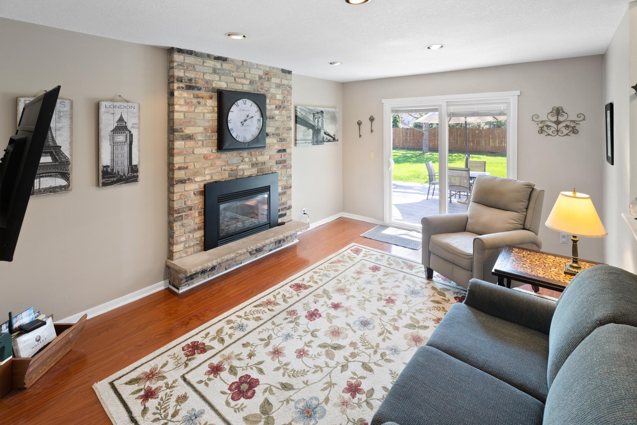 Main Level Family Room has beautiful gas Chicago brick gas fireplace with stone hearth!