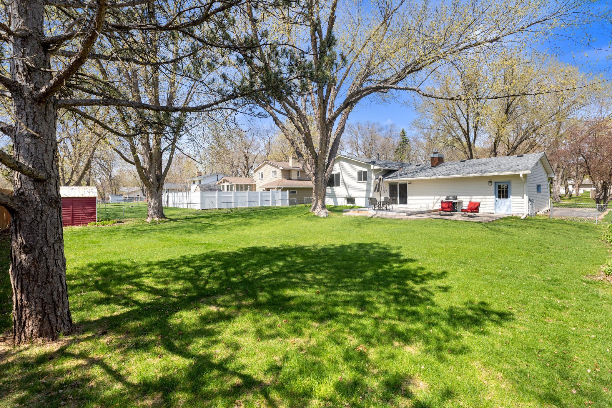 This home offers an incredible flat lot with plenty of room for kids to play or yard games.