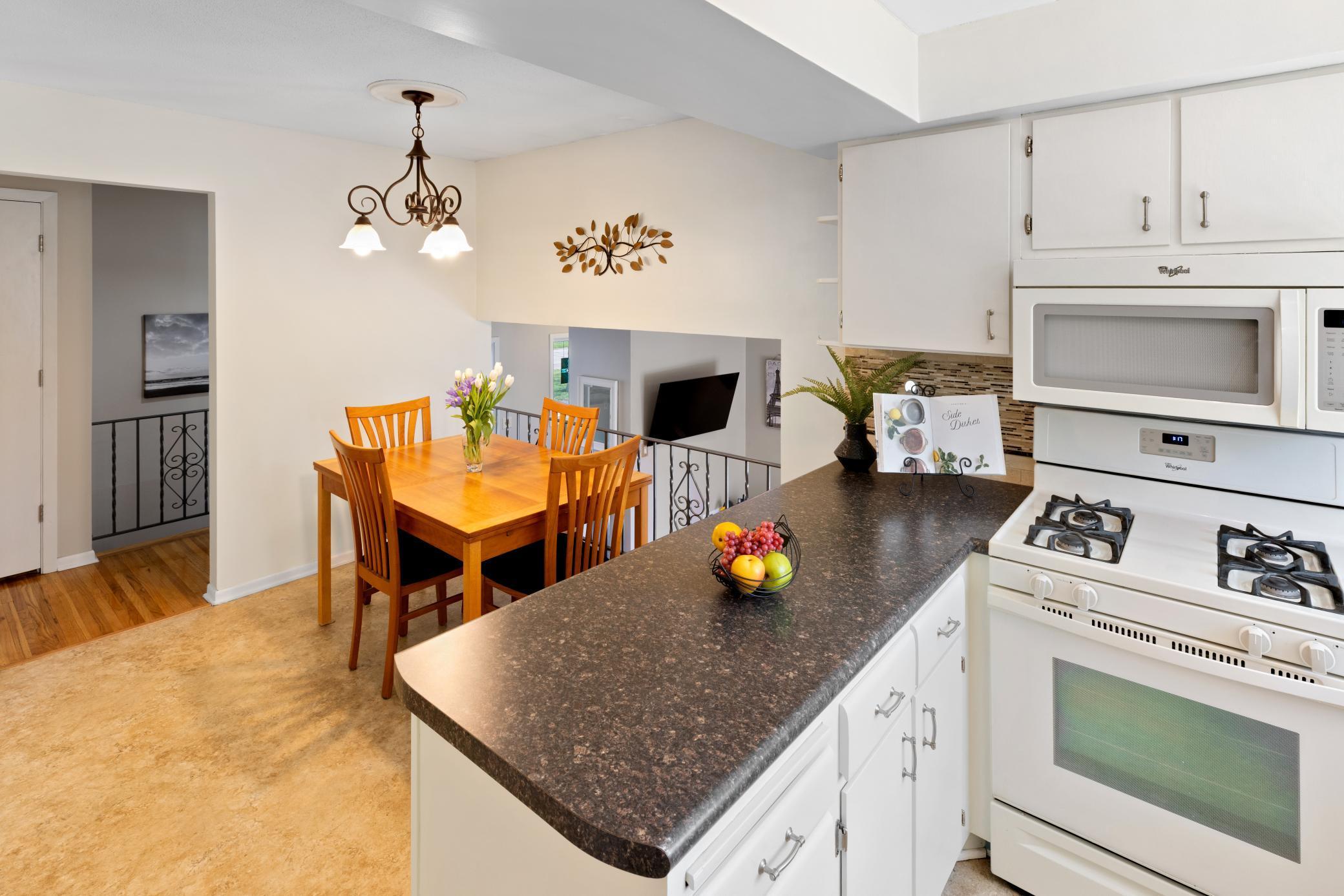 Kitchen has a pantry adjacent to the informal dining area for added storage!