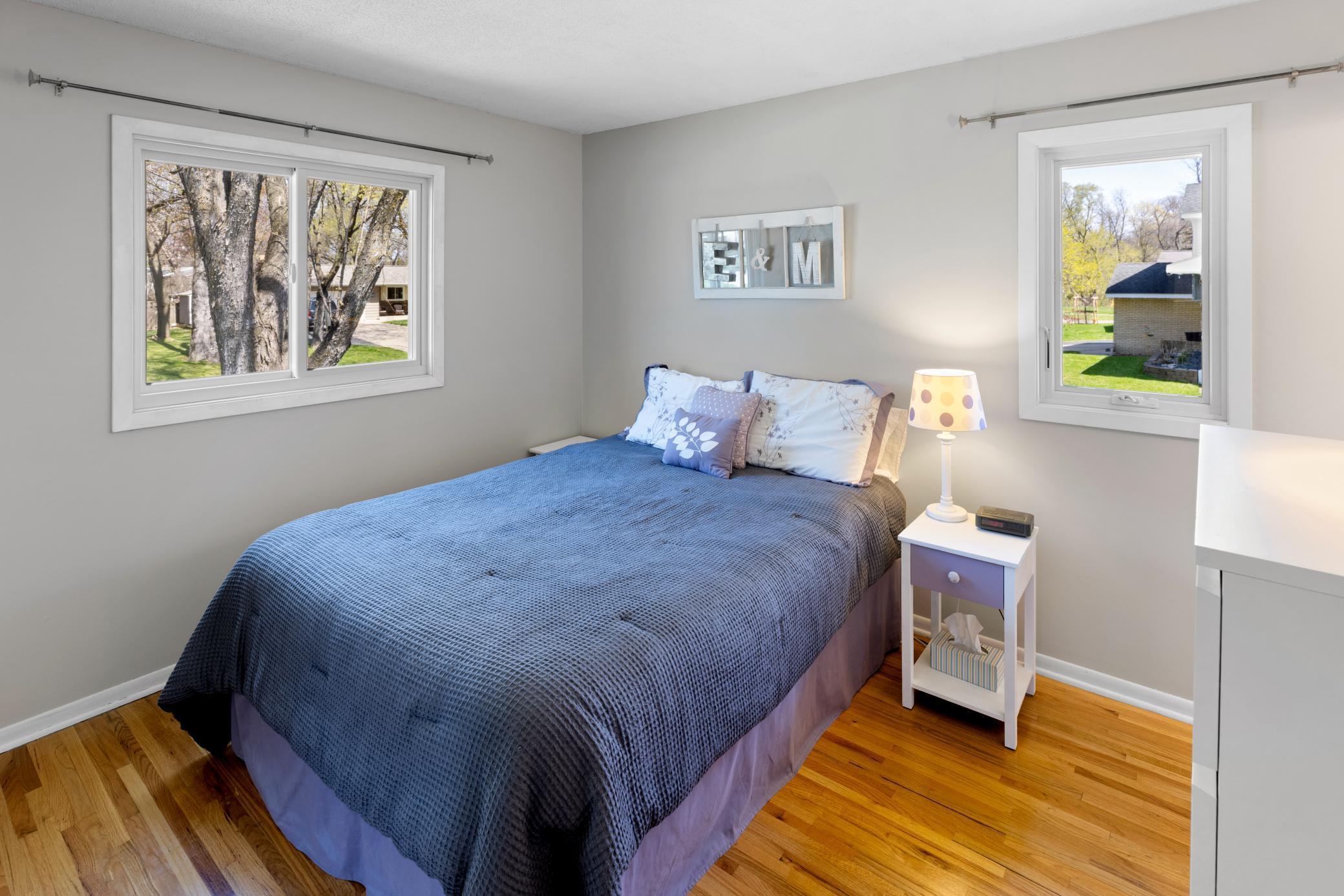 Owner's suite has updated windows, hardwood flooring and white enamel trim.