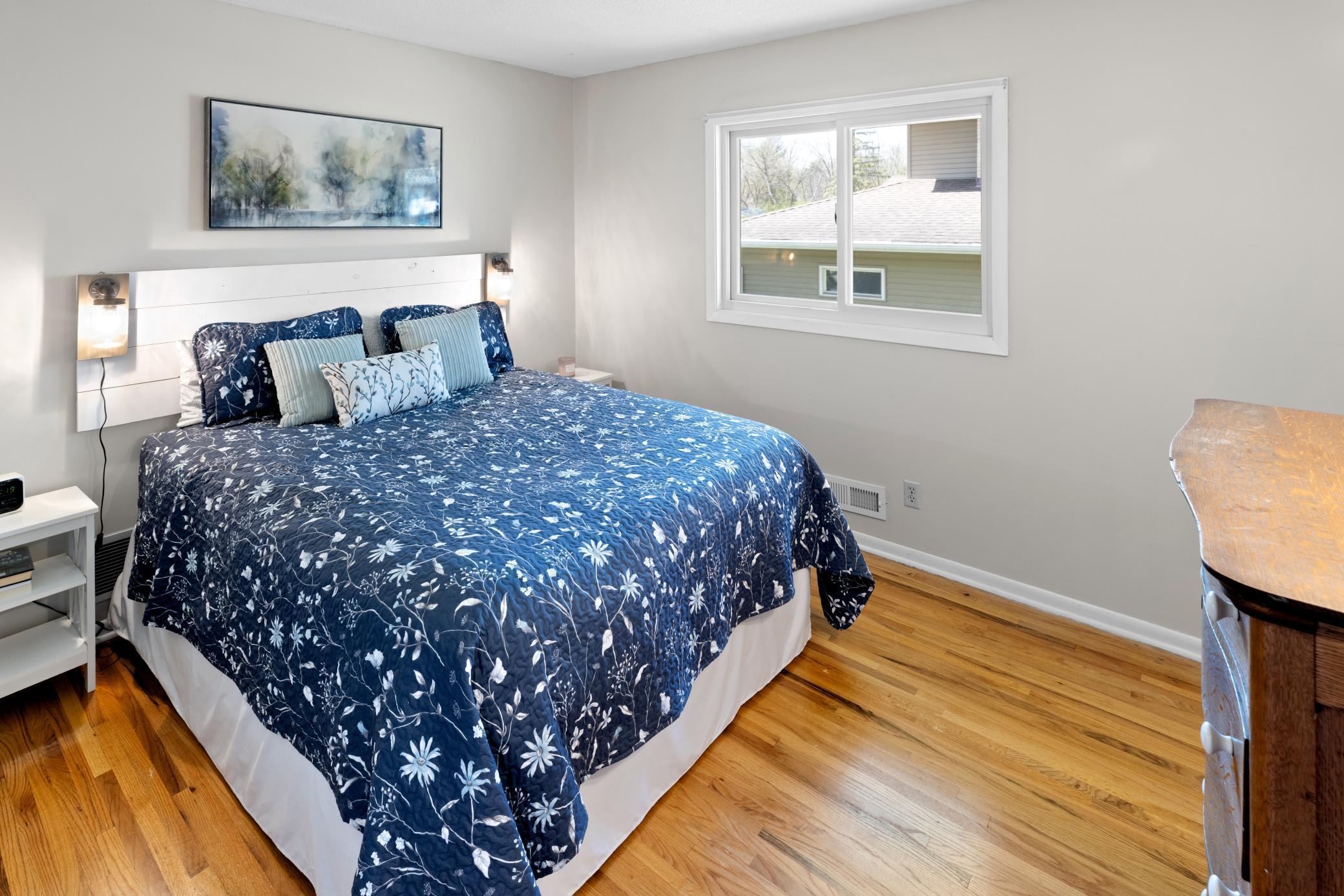 Second Bedroom on Upper Level has newer window, white enamel trim and fresh paint.