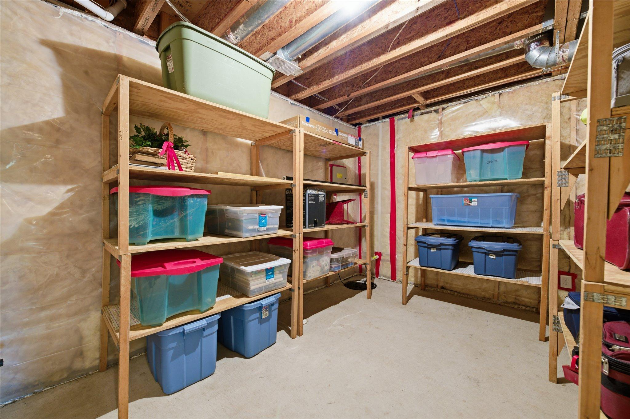 Unfinished Storage room offers many shelves