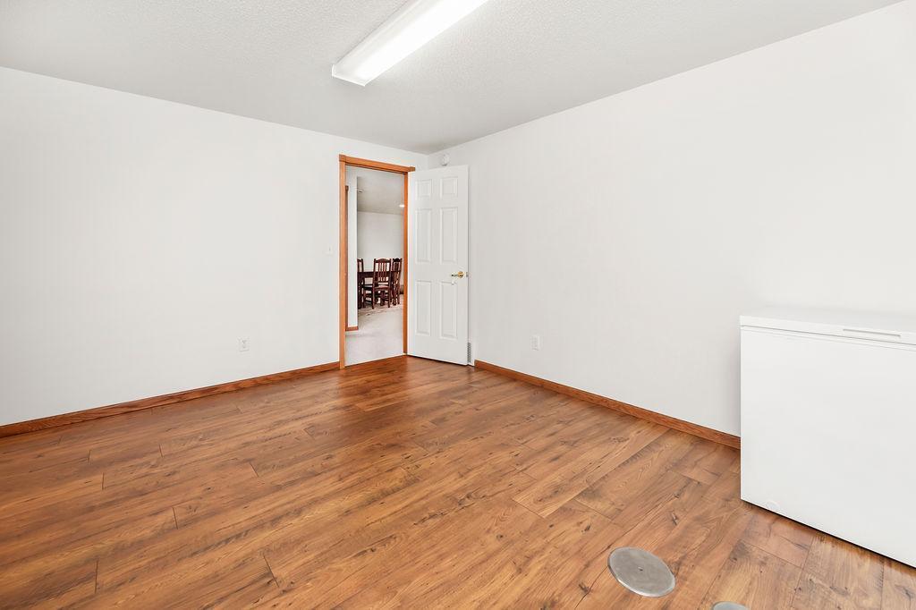 Bedroom 4, spacious w/ large closet, plank floors, egress window.