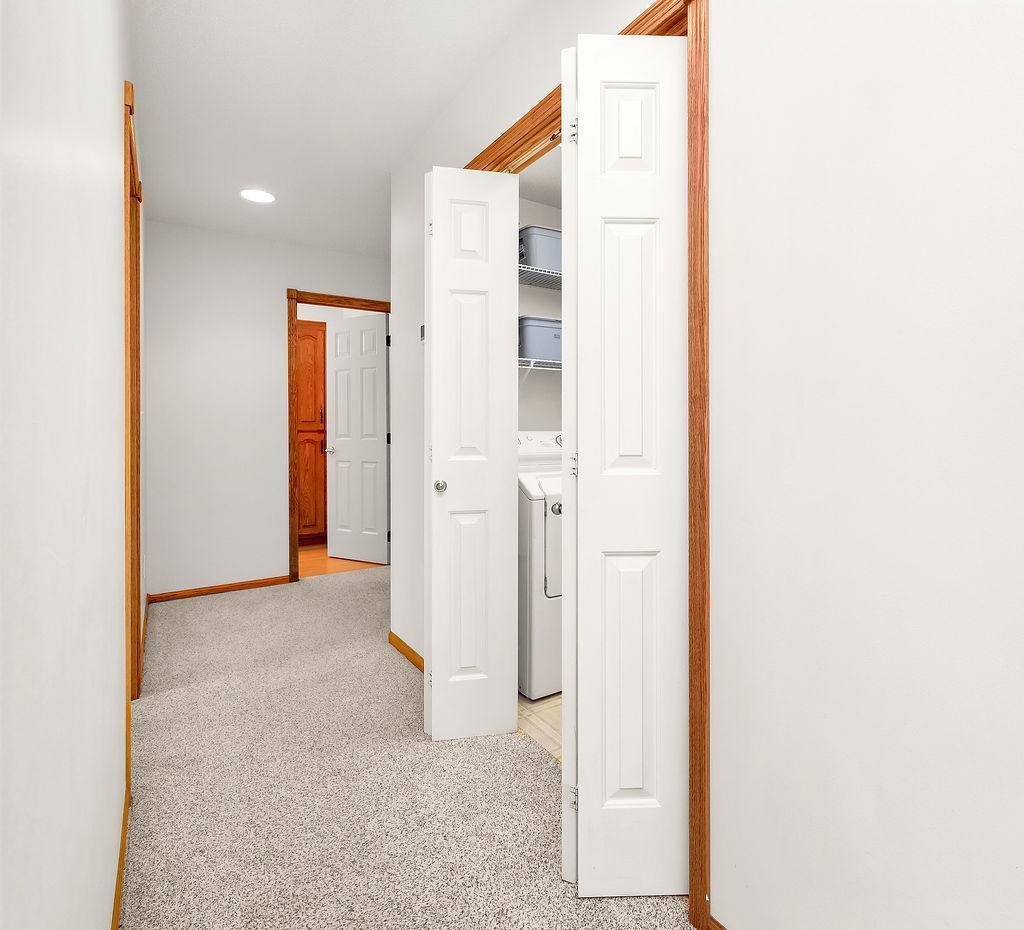 Hallway to laundry & upstairs beds, baths