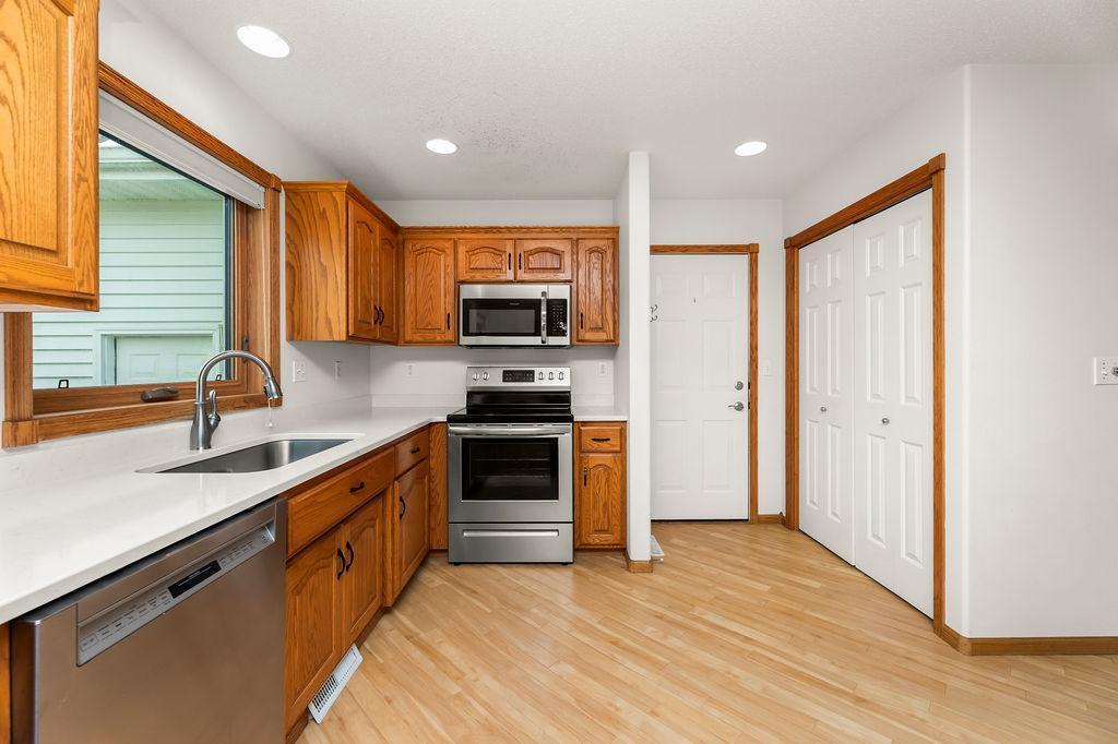 Kitchen w/ storage/pantry closet and entry to Garage