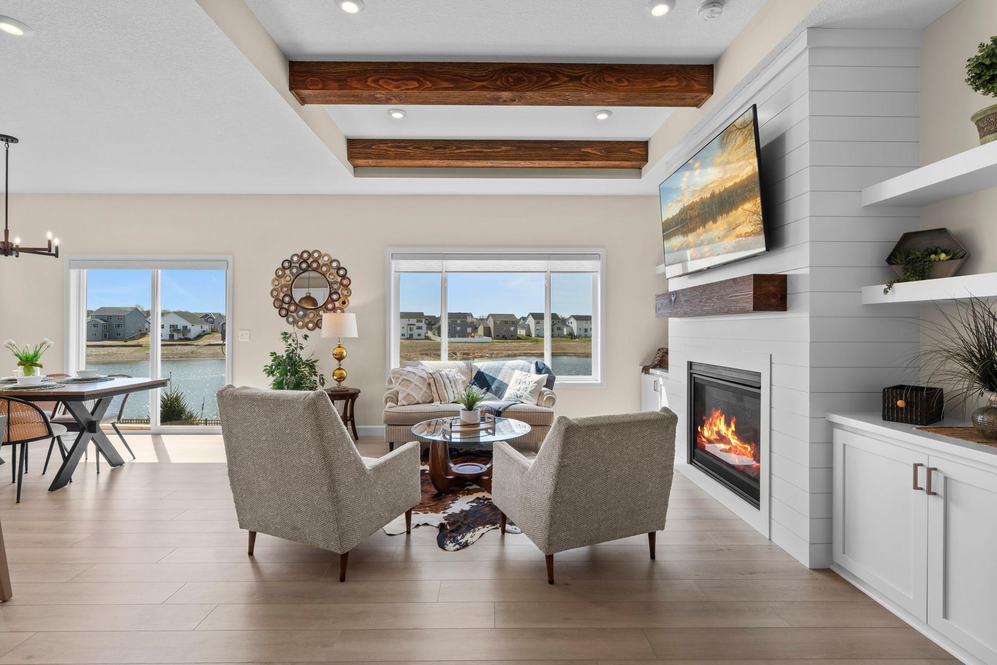 Main level living room with beautiful beams