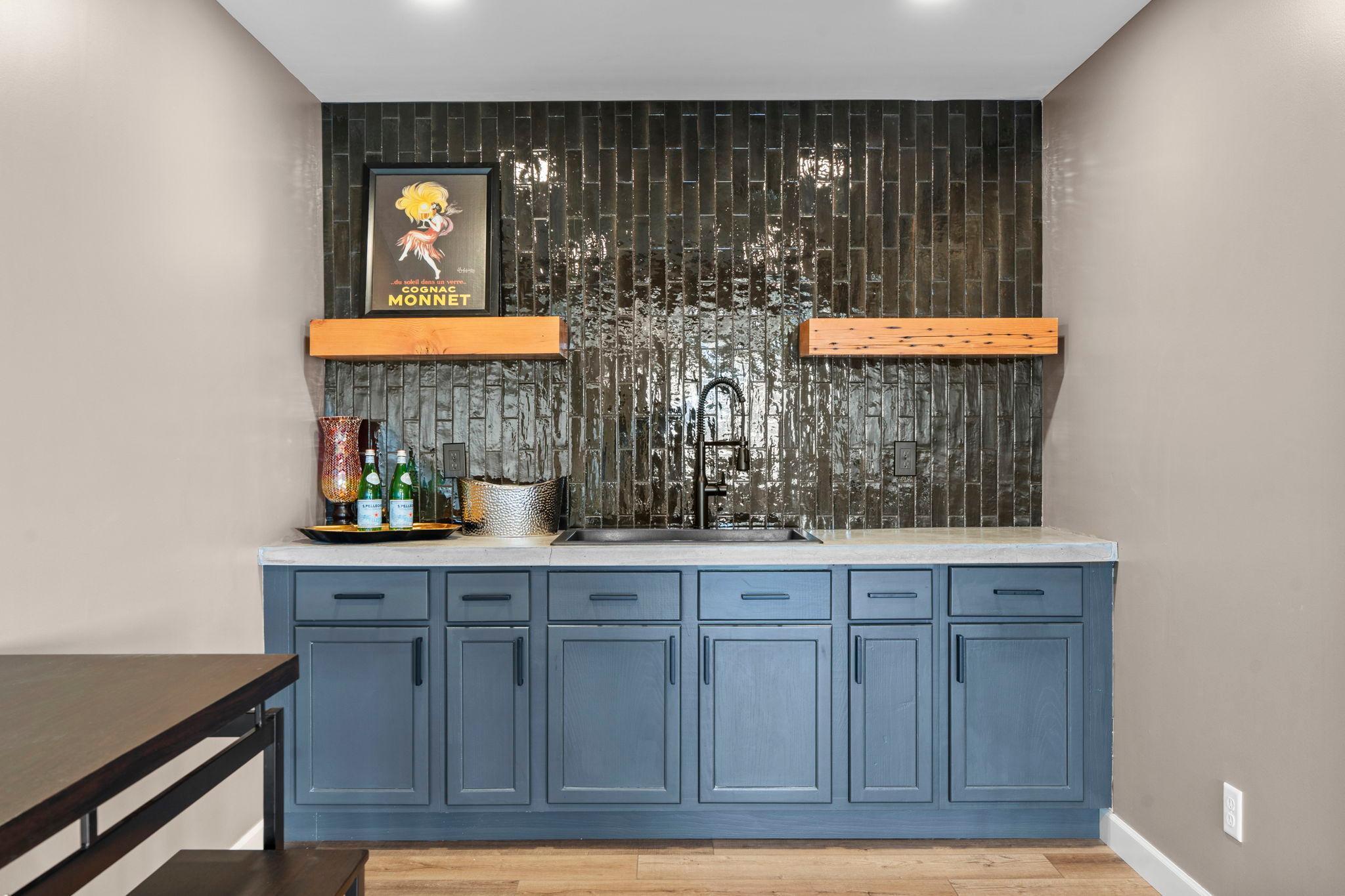 Attractive bar area with tile backsplash