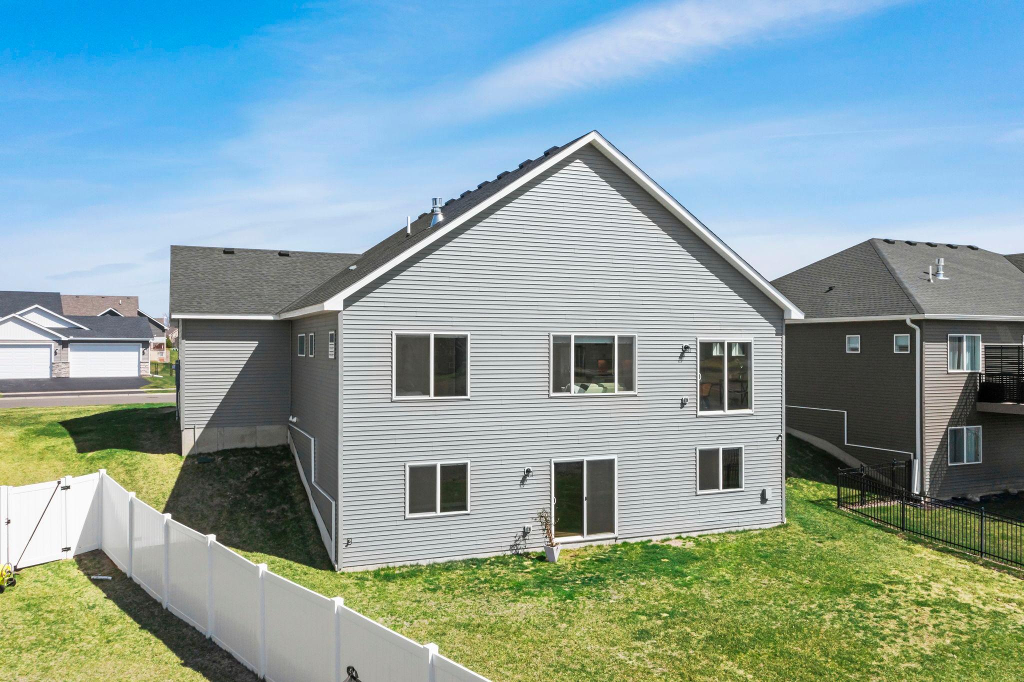 Rear view with 2 patio doors off home