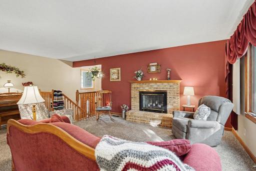 Main living area on the upper level. Let the light shine in~
