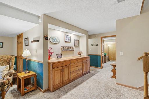 Amazing added built-in at the base of the stairs. Great place to showcase friends and family, with plenty of storage.